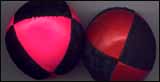 Two chewed juggling balls